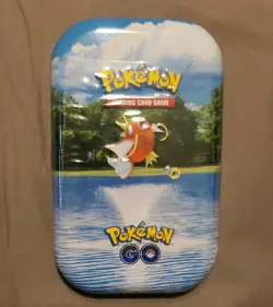 Magikarp Pokemon GO Mini Tin 2 Booster Packs 1 Coin 1 Art Card Pokemon TCG *NEW* - Image 1