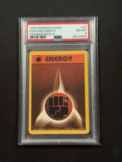 1999 POKEMON BASE SET UNLIMITED TRAINER DECK A #97 FIGHTING ENERGY PSA 8 - Image 1