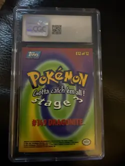 CGC 5.5 Excellent + Dragonite #E12 Topps Pokemon the First Movie First Print - Image 2
