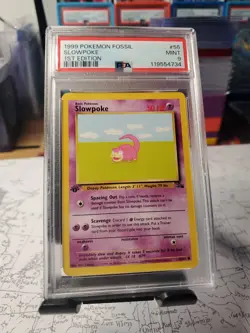 1999 Pokemon Fossil Slowpoke 1st Edition PSA Grade 9 - Image 1