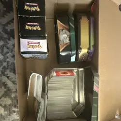 Pokemon TCG Mixed Card Lot in Tins and Boxes - Image 1