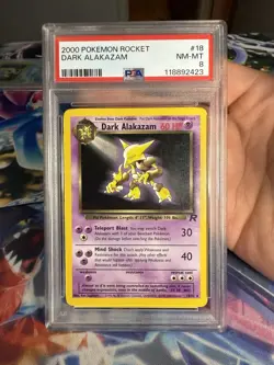 Pokemon 2000 Team Rocket Unlimited Dark Alakazam Non Holo Rare 18/82 PSA 8 - Image 1