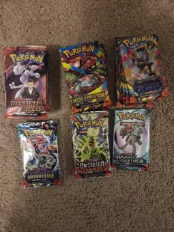 34 Packs Pokemon bulk regulars and holo cards and codes included unused - Image 1