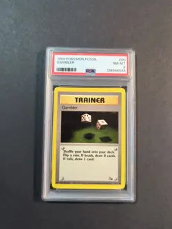 1999 POKEMON FOSSIL #60 GAMBLER PSA 8 - Image 1
