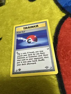 Pokemon 1st Edition Jungle Poke Ball 64/64 LP/NM - Image 1