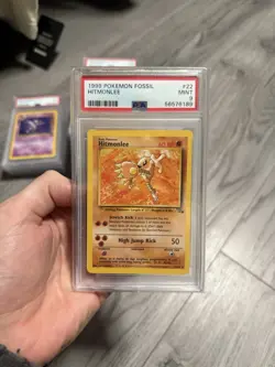 Pokemon 1999 Fossil Hitmonlee #22 PSA 9 - Image 1
