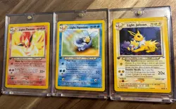 Light Vaporeon Light Flareon Light Jolteon First Edition Pokemon Cards - Image 1