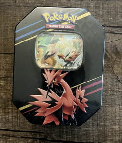 The Pokemon TCG: Crown Zenith Tin International Edition Galarian Zapdos - Image 1