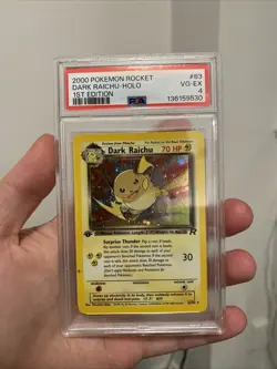 Pokemon PSA 4 1st Edition Team Rocket Holo Dark Raichu 83/82 - Image 1