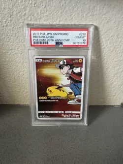 2018 Pokemon PSA 10 Red’s Pikachu JPN SM Promo P. M. CNTR. 20th ANNV. CMP 270 - Image 1
