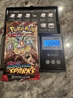 22.40g! HEAVY - Pokemon TCG Surging Sparks Booster Pack Sealed- Possible GODU - Image 1