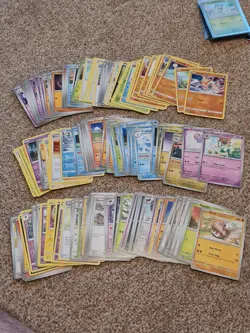Pokemon TCG - Mutiple Card Bundle including small binder, card sleeves, stickers - Image 1