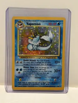 1999 Pokemon Jungle Set “Vaporeon” Holo Foil Card #12/64 w/ 2 Protective Sleeves - Image 1