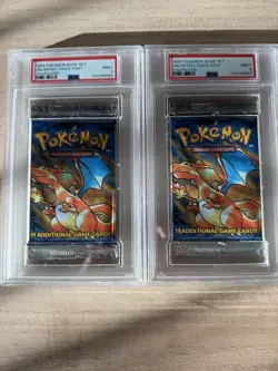 Two 1999 POKEMON BASE SET UNLIMITED-THICK FONT CHARIZARD Packs Two PSA 9 Mint - Image 1