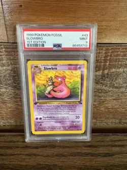 1999 POKEMON FOSSIL 1ST ED #43 SLOWBRO PSA 9 - Image 1