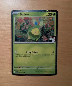 Play! Pokemon Pack Price Series 7 Prismatic Evolutions Cosmo Holo 004/131 Budew - Image 1