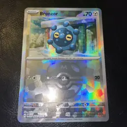 Bronzor Master Ball Holo 066/131 English Prismatic Evolutions Pokemon Card - Image 2