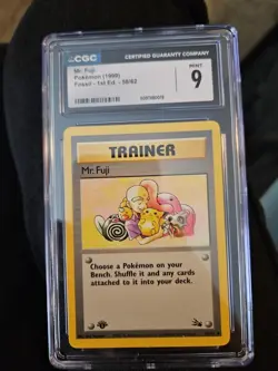 The Pokemon Company Mr. Fuji Fossil 58/62 1st Edition Trainer CGC 9 English - Image 1