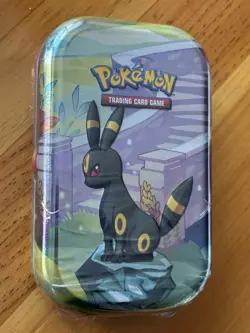 POKEMON TCG PRISMATIC EVOLUTIONS UMBREON MINI TIN, 2 Booster Packs, 1 EEVEE Coin - Image 1