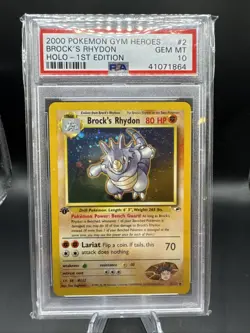 Pokemon First Edition Brock’s Rhydon Gym Heroes Holo #2 PSA 10 (POP 138) - Image 1