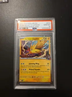 Pokemon TCG Stamped DESTINED Rivals70 TEAM ROCKET'S ZAPDOS PURCHASE BONUS PSA 10 - Image 1
