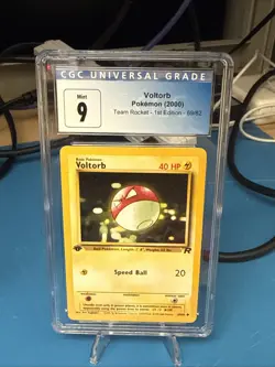 CGC 9 MINT Voltorb Team Rocket 1st Edition 69/82 Pokemon Card - Image 1