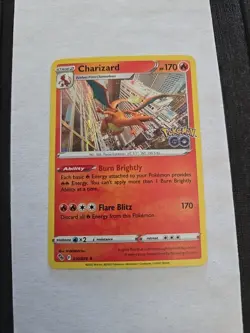 POKEMON CHARIZARD #010/078 RARE HOLOFOIL NM POKEMON GO CARD - Image 1