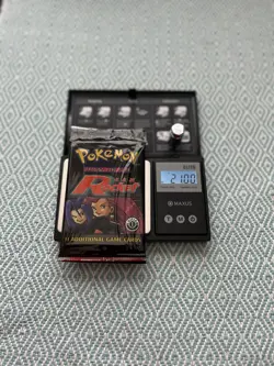 21.00 G HeavyU 1st Edition Team Rocket Booster Pack Wizards of the Coast Pokemon 742818061742 - Image 1