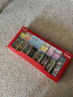 Pokemon Prismatic Evolutions Mini Tins, Set of 8 with Coins and Display - Image 1