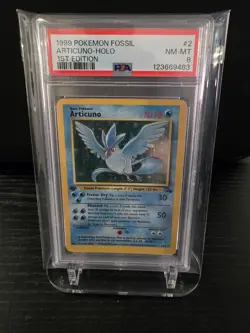 PSA 8 1999 POKEMON FOSSIL | 1ST EDITION ARTICUNO HOLO 2 - Image 1