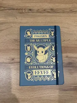 Pokemon x Natural History Museum - Eevee Teal & Gold Ruled Notebook, Exclusive - Image 1