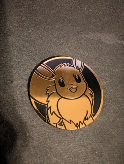 Pokemon TCG Flip Coin Eevee Prismatic Evolutions - Image 1