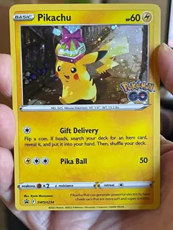 POKEMON PIKACHU SWSH234 POKEMON GO PROMO BLACK STAR COSMOS HOLO NM CARD - Image 1