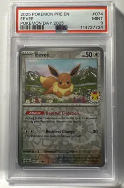 2025 POKEMON PRISMATIC EVOLUTIONS #074 EEVEE POKEMON DAY 2025 STAMPED PSA 9 - Image 1
