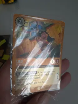 Lorcana Card LILO Escape Artist 25/P2 Azurite Sea Glitter Gold Foil Sealed Promo - Image 1