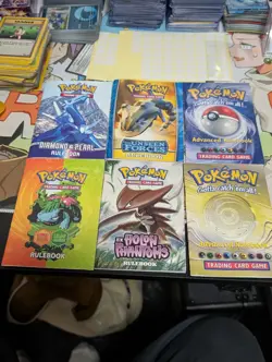Pokemon Rule Book/Card List Lot with 6 Booklets, 2 Old Playmats, & Deck Box - Image 1