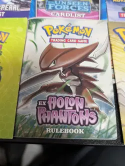 Pokemon Rule Book/Card List Lot with 6 Booklets, 2 Old Playmats, & Deck Box - Image 4