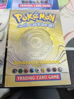Pokemon Rule Book/Card List Lot with 6 Booklets, 2 Old Playmats, & Deck Box - Image 5