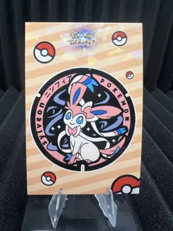 Badge Sylveon - Cracked Ice Holo - Let's Go Eevee Database - Pokemon Card NM - Image 1