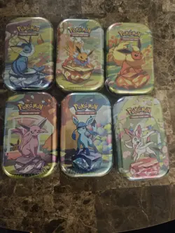 Pokemon Prismatic Mini Tins Lot of 6– Factory Sealed - Image 1