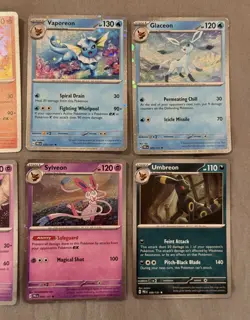 Pokemon Prismatic Evolutions Costco Mini Tin Cosmo Promos 8 Umbreon Sylveon - Image 3