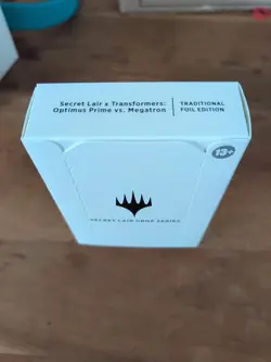 MTG Secret Lair x Transformers: Optimus Prime vs. Megatron Foil Edition, Sealed - Image 1