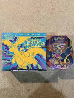 Pokemon TCG: Ascended Heroes Elite Trainer Box & Mega Charizard Y Tin In Hand - Image 1