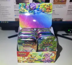 Pokemon Prismatic Evolutions 8 Mini-Tins Sealed In Box - Image 1