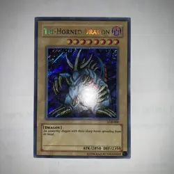 Tri-Horned Dragon LOB-000 Secret Rare Heavy Foil Bleed 🩸 Misprint - Image 1
