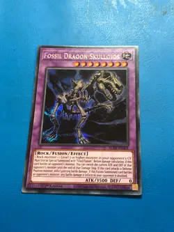 YUGIOH Secret Rare Fossil Dragon Skullgios BLAR-EN009 1st Edition - Image 1