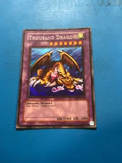 YUGIOH Secret Rare Thousand Dragon MRD-E143 PLAYED - Image 1