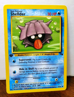 POKEMON SHELLDER 54/62 1ST EDITION FOSSIL LP-NM - Image 1