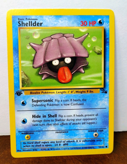 POKEMON SHELLDER 54/62 1ST EDITION FOSSIL LP - Image 1