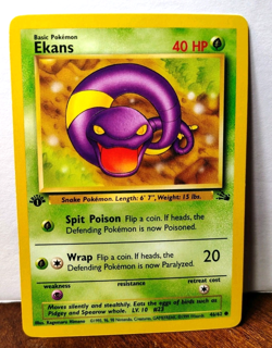 POKEMON EKANS 46/62 1ST EDITION FOSSIL LP - Image 1